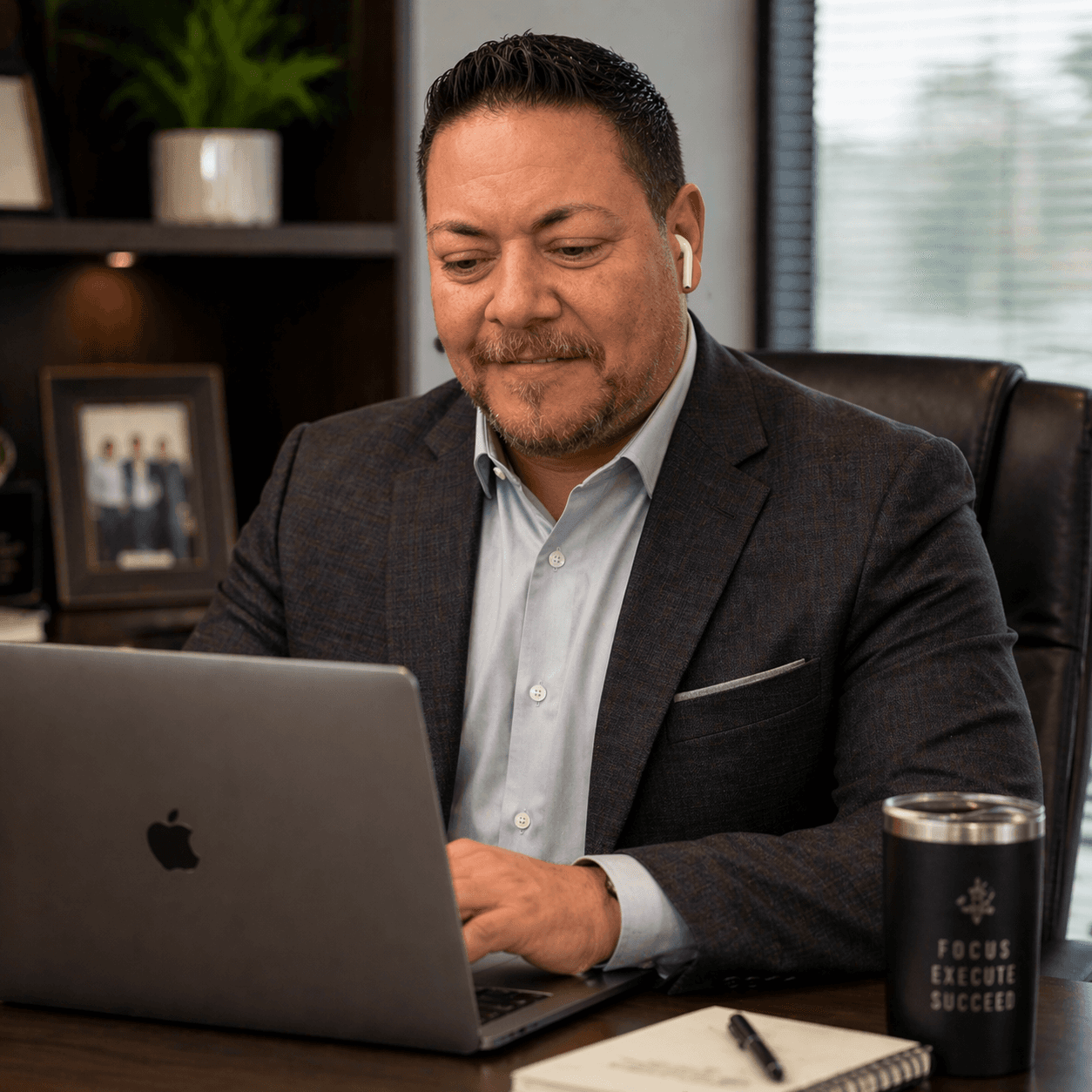 Ken Ramirez working at a laptop
